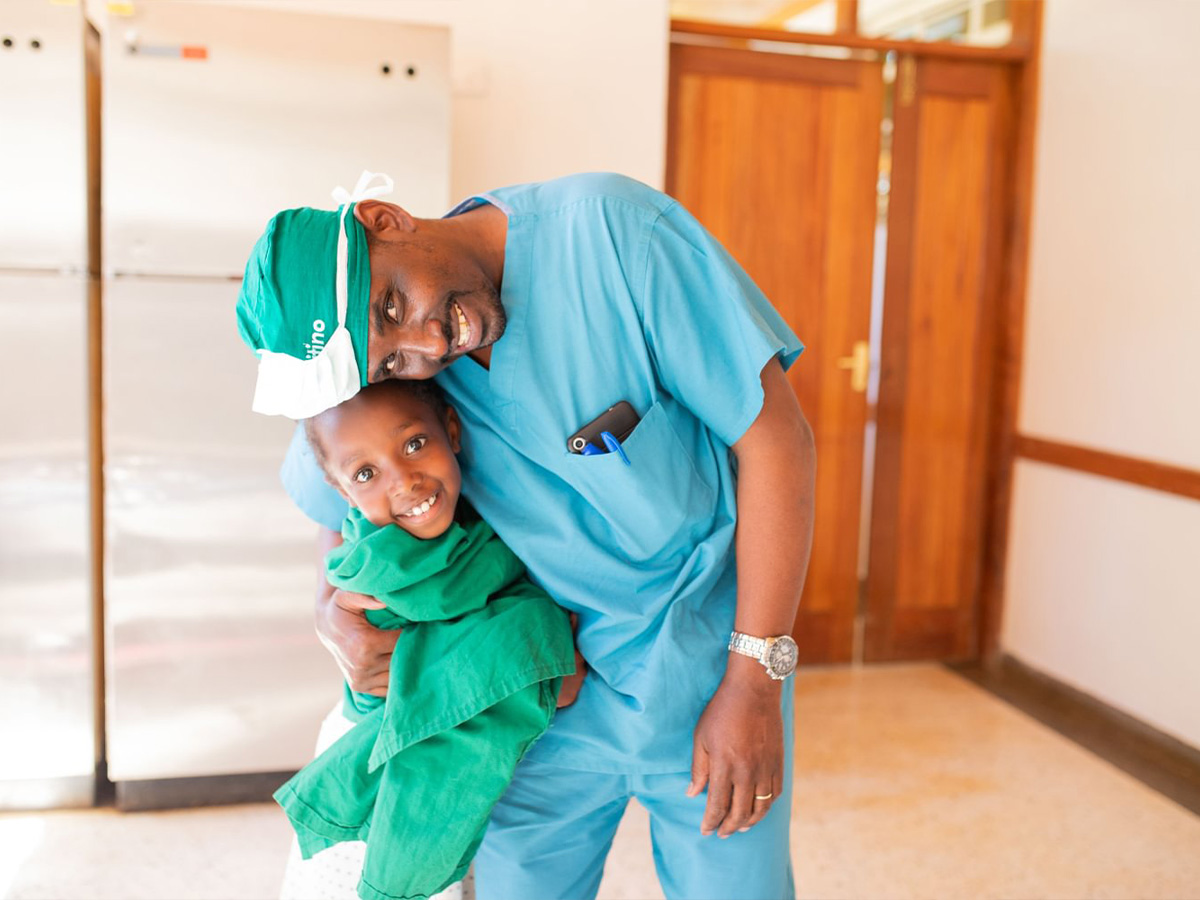 Doctor showing child their phone